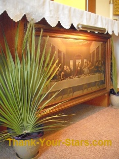 Palms by Last Supper Image on Altar in a Church