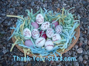 Easter Eggs in Basket on Rocks in Driveway.